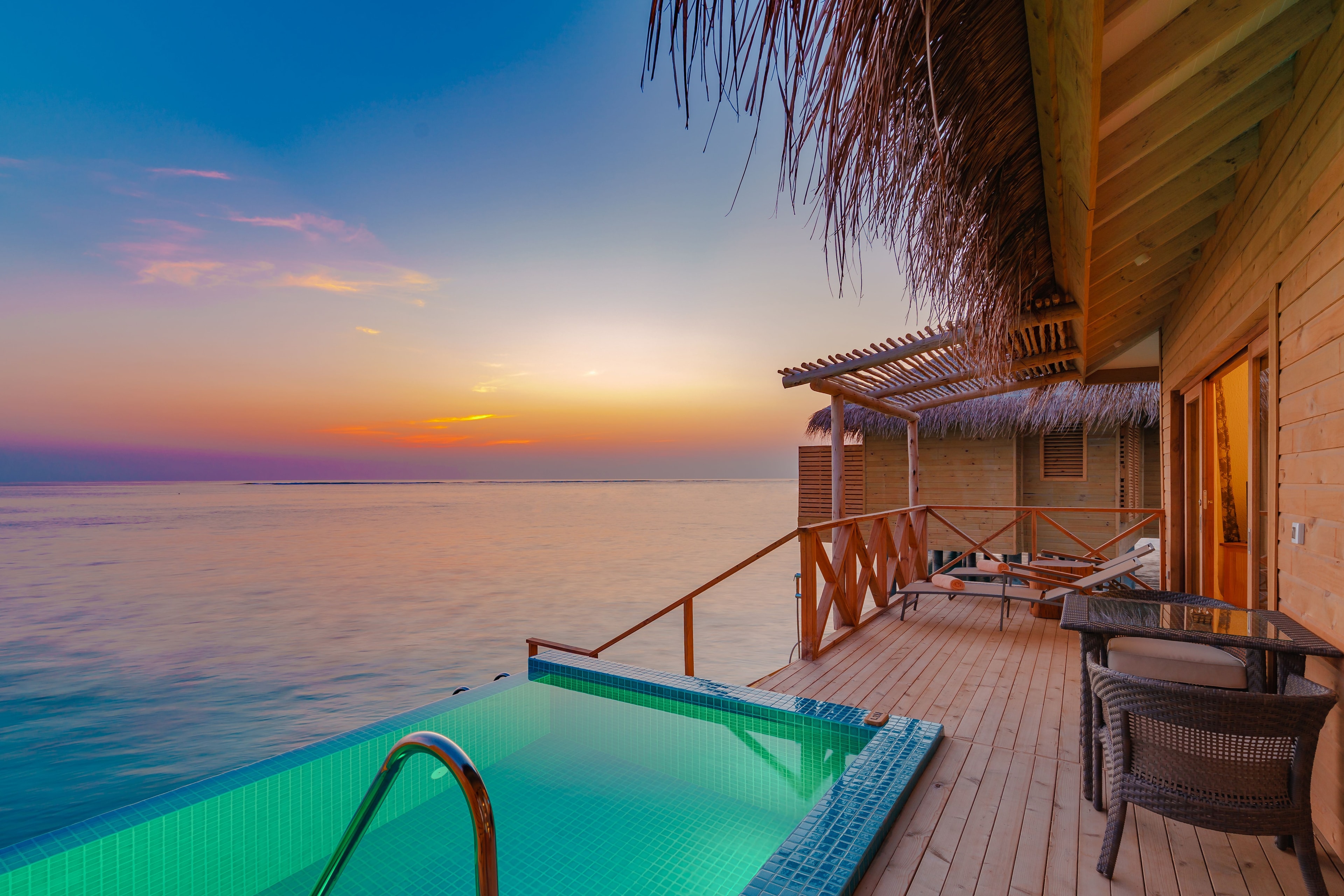 Overwater villas extending into crystal-clear turquoise waters
